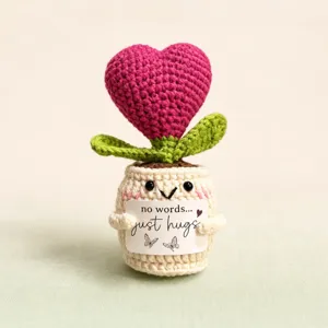 Handmade crochet heart potted plant toy detail, cute yarn flower doll desktop ornament.