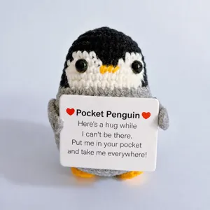 Handmade crochet penguin plush toy detail view, cute mini animal gift with card.