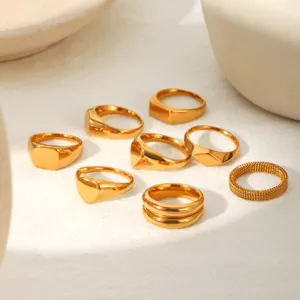 Gold plated stainless steel ring details, stacking geometric rings set close up view.