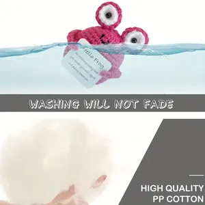 Handmade crochet pink frog plush doll, cute stuffed animal toy for desktop and car decor.