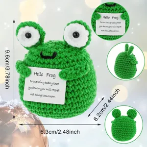 Handcrafted crochet frog detail view showcasing dimensions and card design clearly.