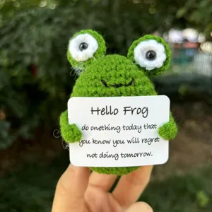 Handmade crochet green frog doll with positive quote card cute desktop decoration toy.