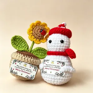 Handmade crochet Christmas snowman and sunflower potted detail, festive knitted toy gift.