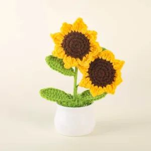 Handmade crochet sunflower potted plant detail, cute wool knitted flower desk decor ornament.