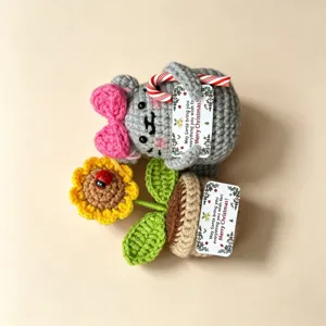 Handmade crochet Christmas plush doll ornament with sunflower pot, cute holiday gift decor.