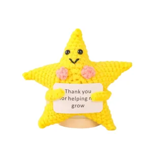 Handmade crochet star doll with encouragement sign, cute plush toy gift for desk decor.