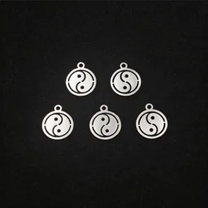 Stainless steel hollow yin yang charm pendant detail, silver tone metal DIY jewelry part.