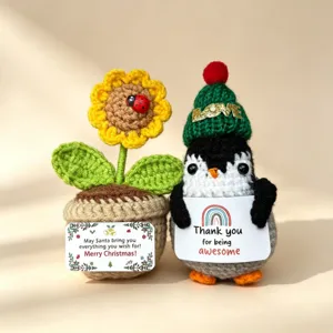 Handmade crochet Christmas penguin and sunflower potted doll, cute holiday gift ornament.