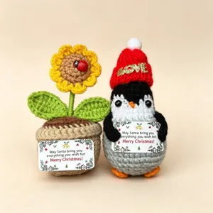 Handmade crochet Christmas penguin and sunflower potted dolls, cute holiday gift decoration details.