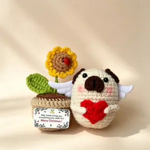 Handmade crochet Christmas pug doll and sunflower potted ornament set for holiday gifts.