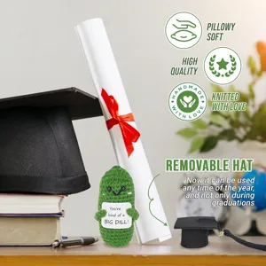 Cute knitted pickle plush toy with removable graduation cap, perfect funny gift and graduation decor.