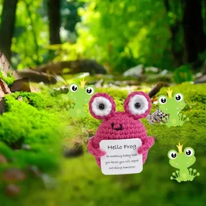Handcrafted crochet pink frog doll with card detail showing cute handmade woolen ornament design.