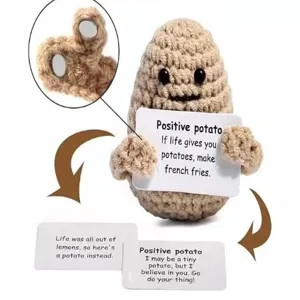 Handmade crochet positive potato doll with cute design and inspirational message cards for decor.