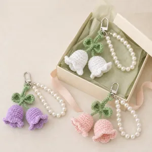 Handmade crochet lily of the valley keychain with pearl strap, cute bag charm gift.