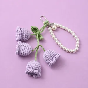 Korean style cute crochet lily of the valley keychain with white pearl strap bag charm.