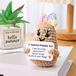 Crochet positive potato doll with cute bow and encouraging card, adorable desktop decor.