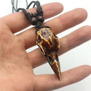 Resin bird skull pendant necklace close-up, punk gothic style retro jewelry detail shot.