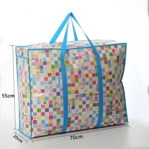 Detail view of large waterproof storage bag with colorful grid pattern and blue handles.