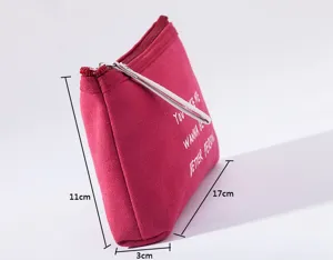 Multifunctional canvas zipper cosmetic bag storage pouch with letter print and portable wrist strap.