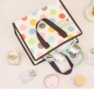 Pequeño bolso de tela no tejida con lunares de colores, bolso portátil con cremallera.