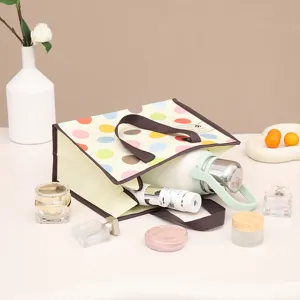 Bolsa de compras plegable laminada de tela no tejida con topos de colores