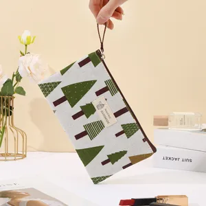 Canvas cosmetic bag with tree pattern, portable zipper pouch for travel and daily storage.