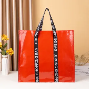 Grote rode gelamineerde geweven boodschappentas stijlvolle draagbare reistas tote bag voor dagelijks.
