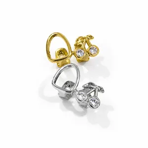 Detailed view of gold and silver cherry design double tooth grillz hip hop teeth jewelry