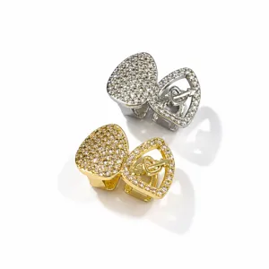 Hip hop grillz set featuring heart pierced arrow design with dazzling cubic zirconia stones.