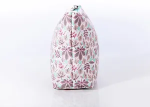 Close-up detail view of the botanical leaf printed cosmetic pouch side profile design.