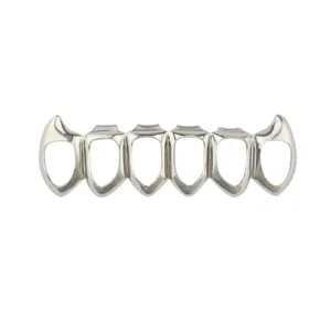 Detail view of silver hollow hiphop teeth grillz, punk vampire style costume accessory.