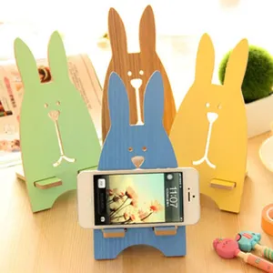 Wooden cartoon rabbit phone stand, cute desktop holder compatible with most mobile phones.