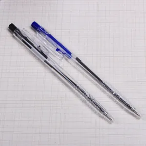 Transparent retractable ballpoint pens detail view, black and blue ink office pens.
