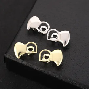 Hip hop gold and silver fangs grillz with heart cutout, cool street style teeth accessories.