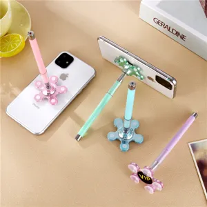 Detail view of creative suction cup pen serving as phone stand with multi-flower base design.