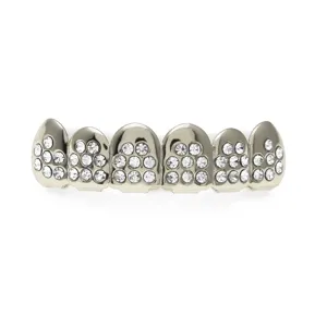 Close-up detail of rhinestone iced out hip hop grillz teeth for party costume fashion style.