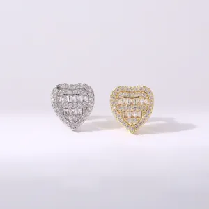 Detailed shot of iced out heart grillz single teeth caps, gold and silver cubic zirconia.