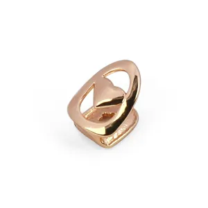 Rose gold single tooth grill with cute heart cutout hip hop rapper fashion accessory