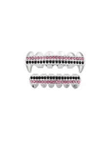 Detail view of hip-hop grillz teeth with vampire fangs and pink black rhinestones.