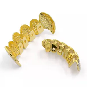 Close-up detail view of iced out gold plated hip hop teeth grillz with sparkling cubic zirconia.