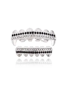 Detailed close-up of silver hip-hop grillz with sparkling black and white rhinestones and fangs.