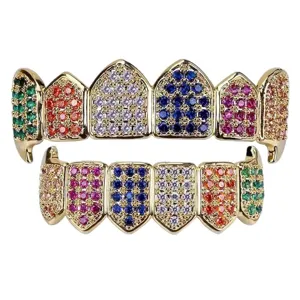 Hiphop gold grillz set featuring colorful pave cubic zirconia stones and sharp vampire fang teeth jewelry.
