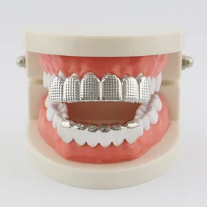 Hip hop silver grillz teeth set with textured top and smooth bottom for unisex wear.