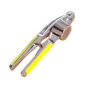 Manual zinc alloy garlic press with yellow handles, durable kitchen tool for easy cooking.