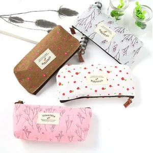 Floral canvas pencil case with zipper and aesthetic label, cute stationery pouch for students.