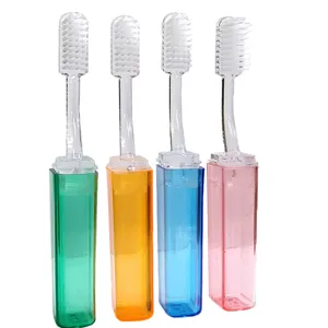 Set de cepillos de dientes de viaje portátiles con mango transparente y estuches de colores.