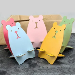 Cute bear phone stand for desk, foldable plastic mobile holder, kawaii desktop ornament.