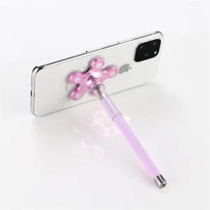 Suction cup phone stand pen detailed view showing the pink flower holder and purple gel pen.