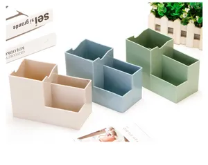 Detailed view of the multi-compartment plastic desk organizer, pen and stationery holder.