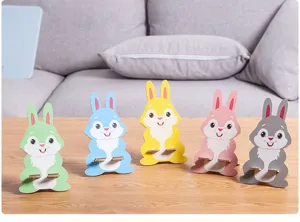 Wooden cartoon rabbit phone stand detail view, cute desktop holder for smartphones and gifts.